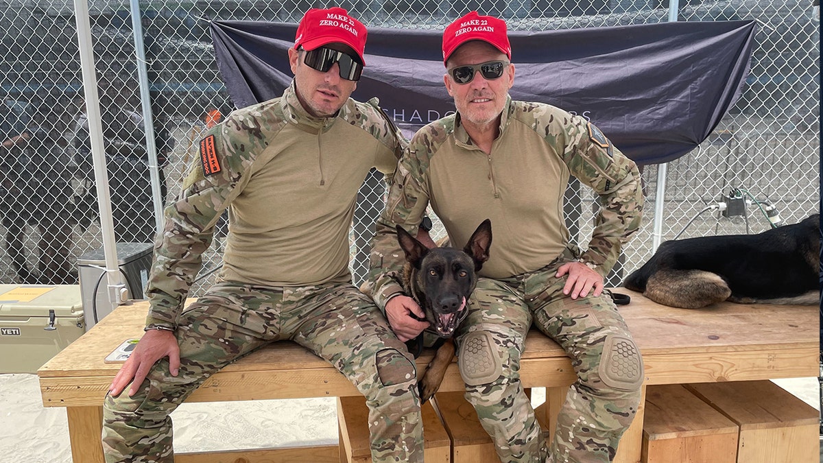 Joshua Perry and Mark Geist with a K9 service dog in N.J.