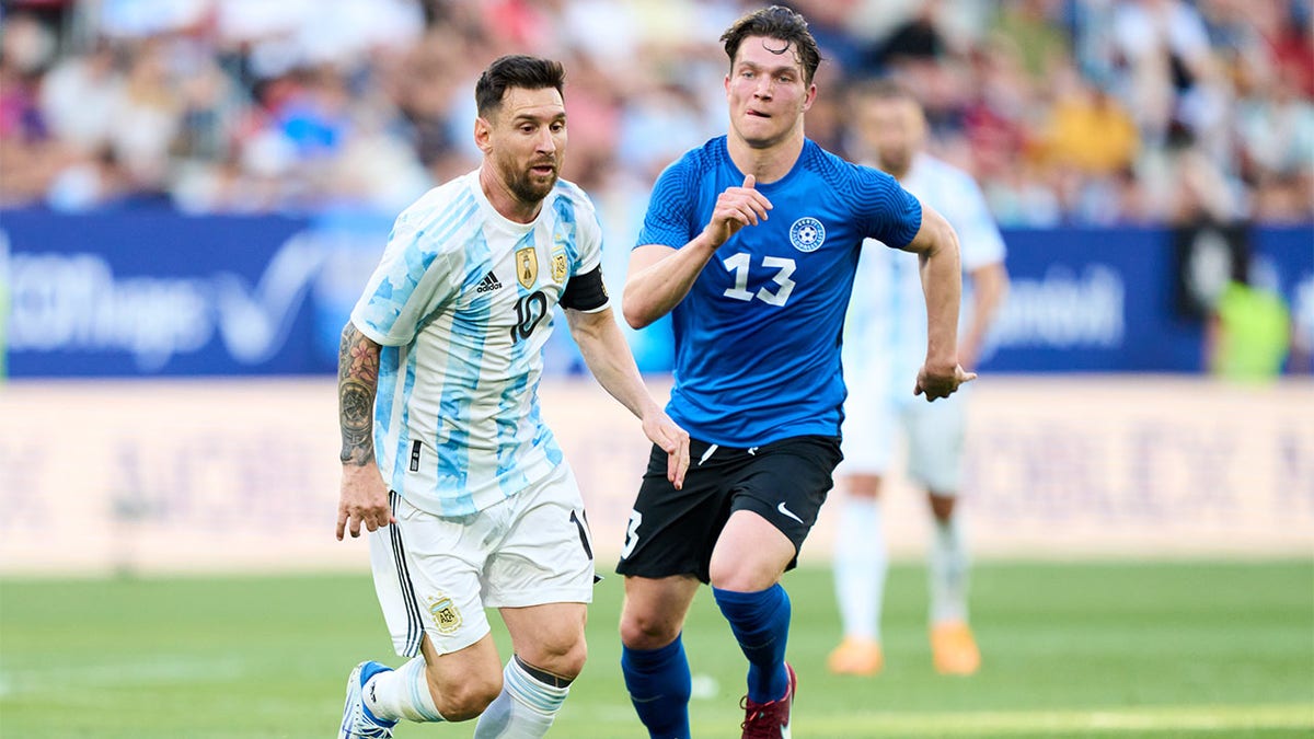 Lionel Messi in pursuit of the ball