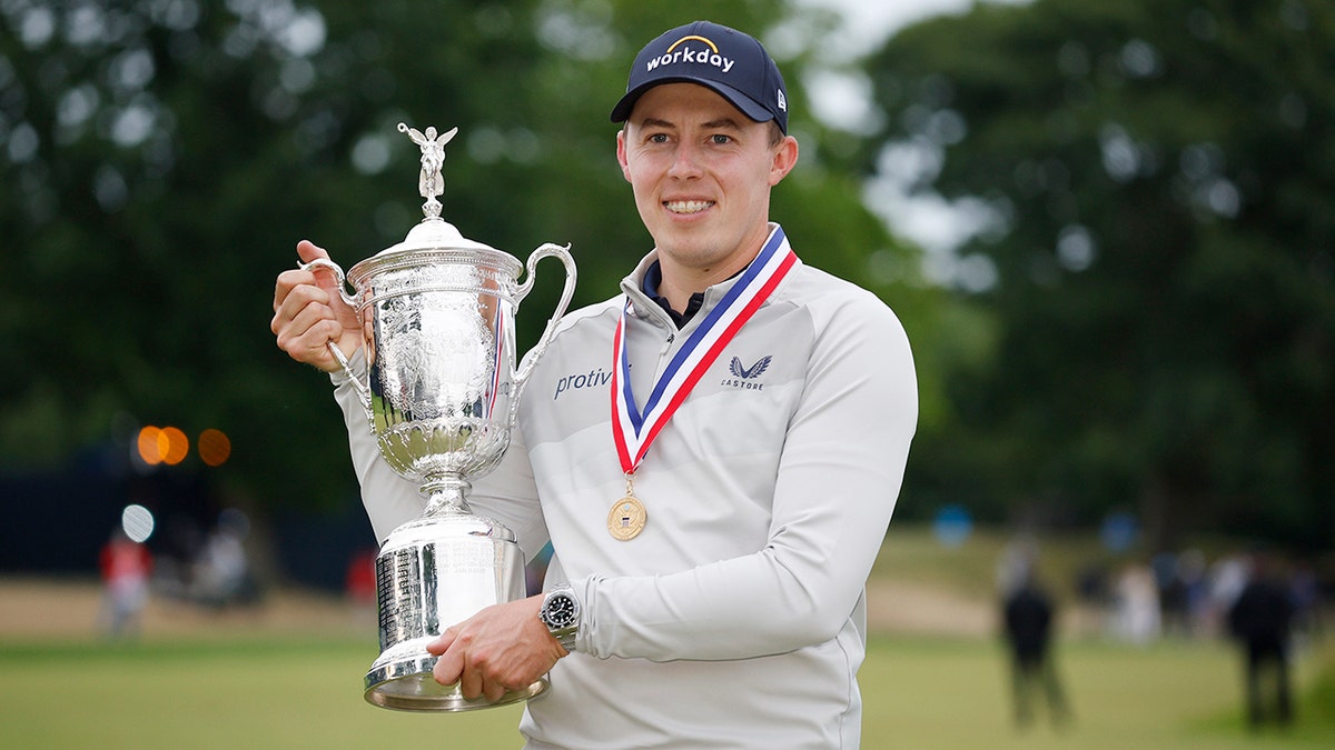 Matt Fitzpatrick holes the US Open trophy