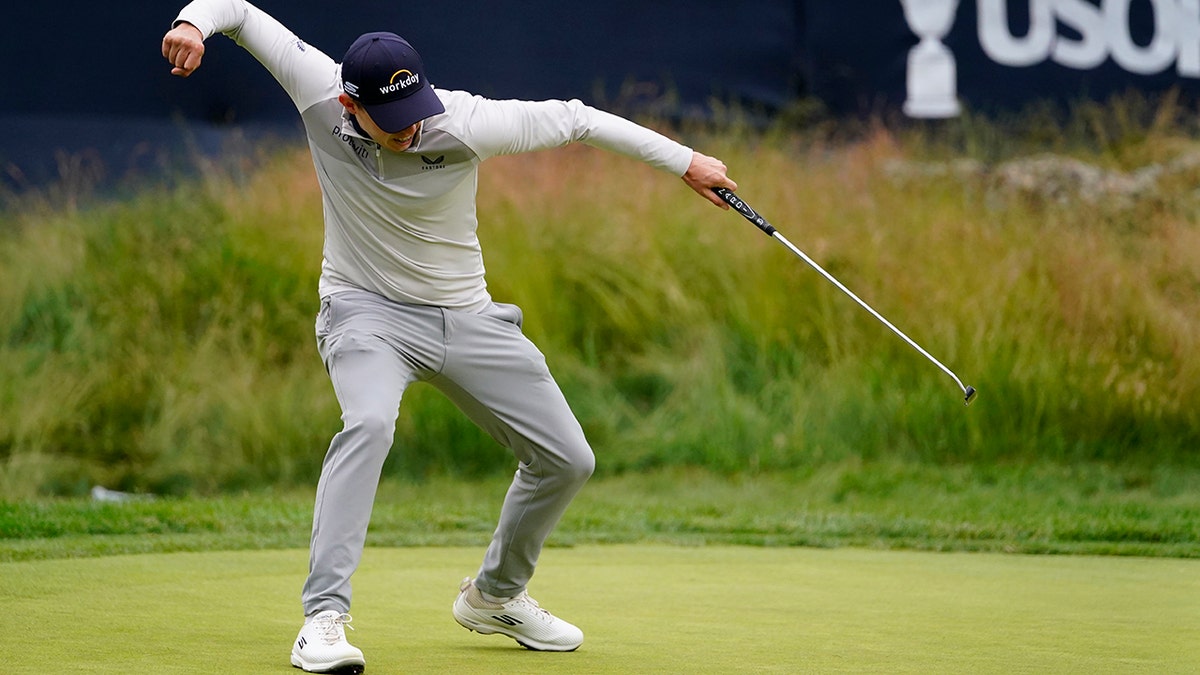 Matt Fitzpatrick pumps his fist on 13