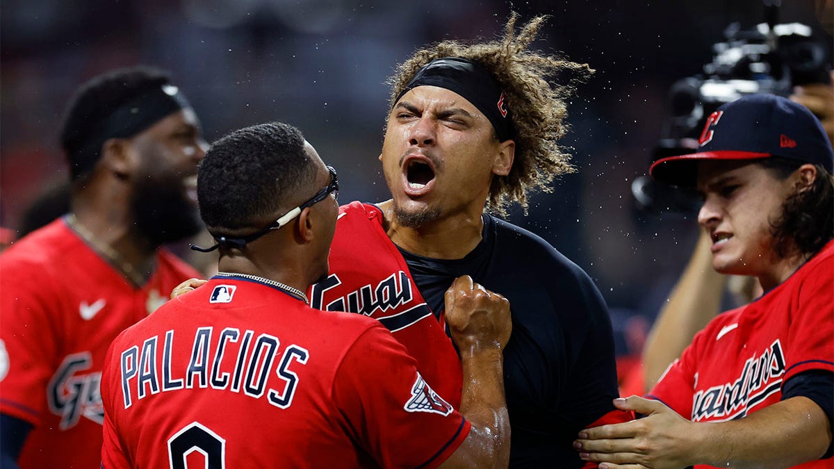 Josh Naylor is mobbed by teammates at home plate