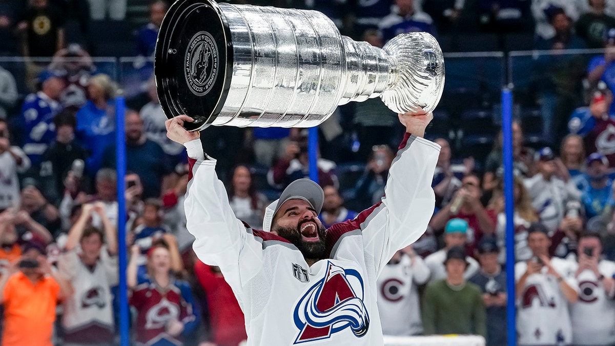 Nazem Kadri carries the Stanley Cup trophy