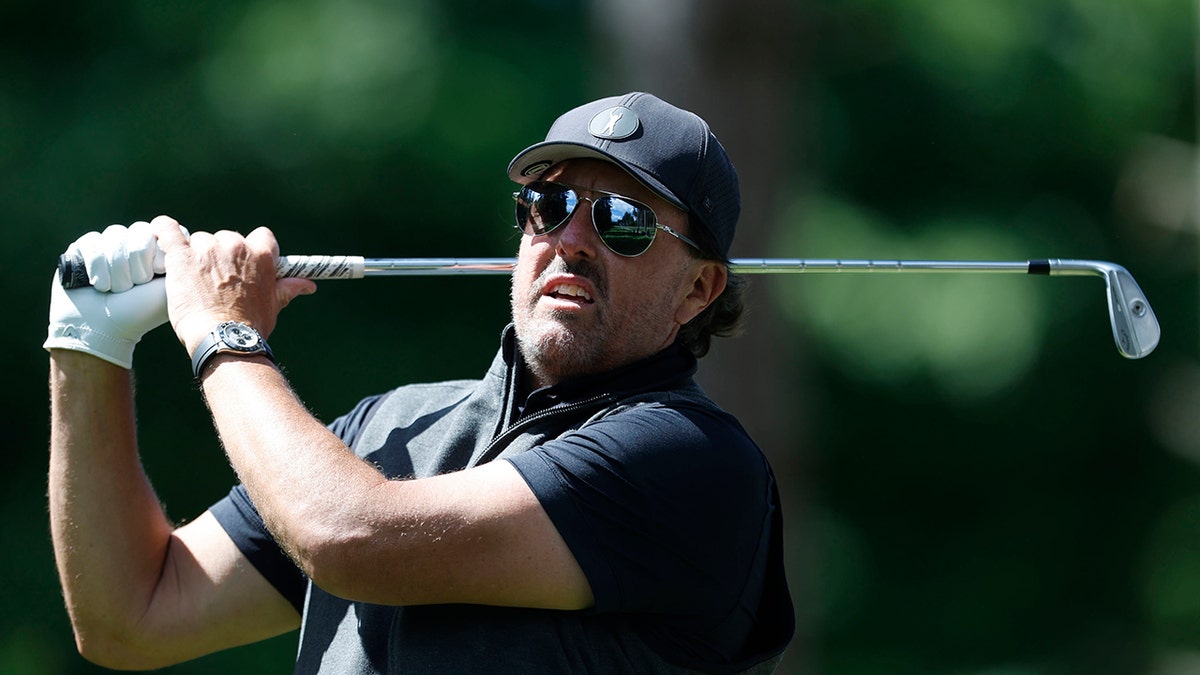 Phil Mickelson swings his club