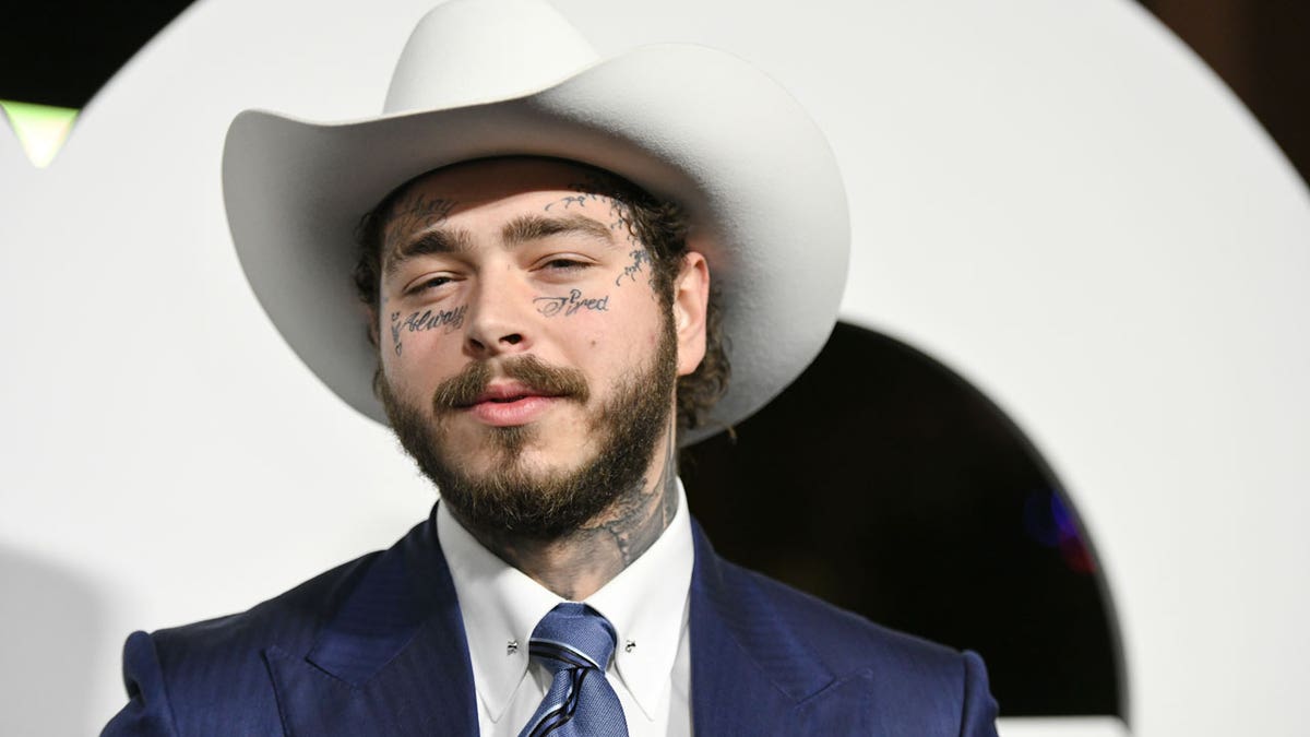 Post Malone poses on the red carpet