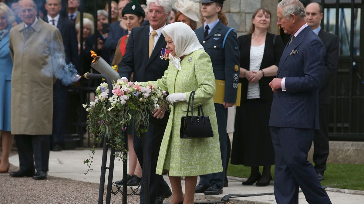 Queen Elizabeth II lights the principal beacon