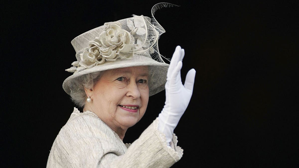 Queen Elizabeth waves during the Service of Thanksgiving