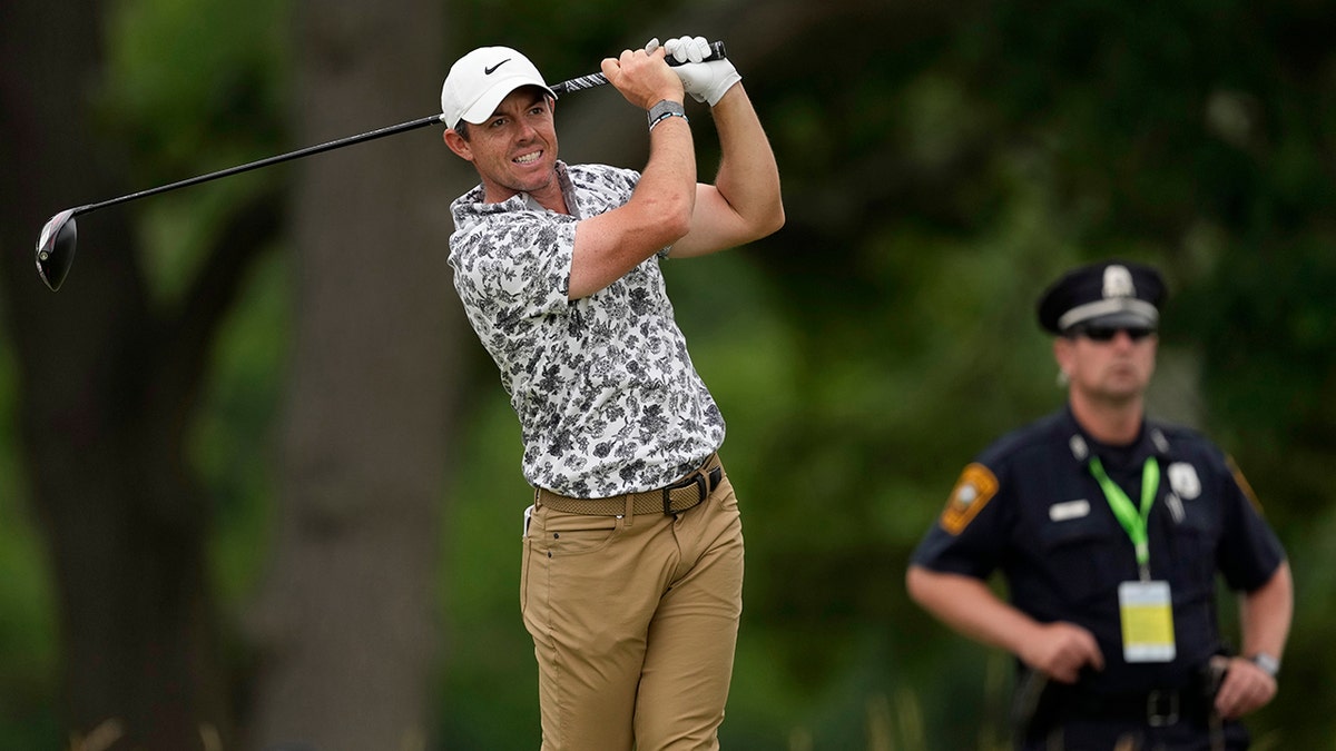 Rory McIlroy watches his 4th-hole shot