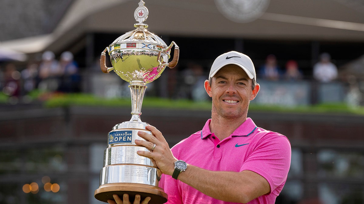 Rory McIlroy holds the trophy