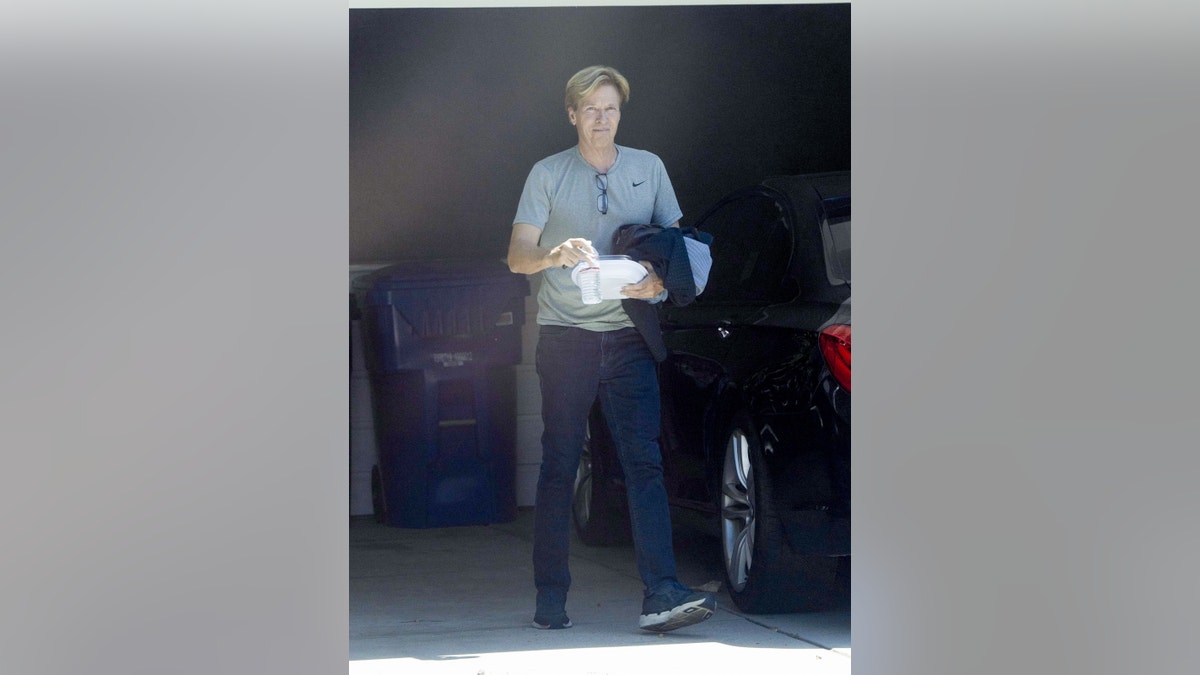 Jack Wagner holds a water bottle as he's photographed