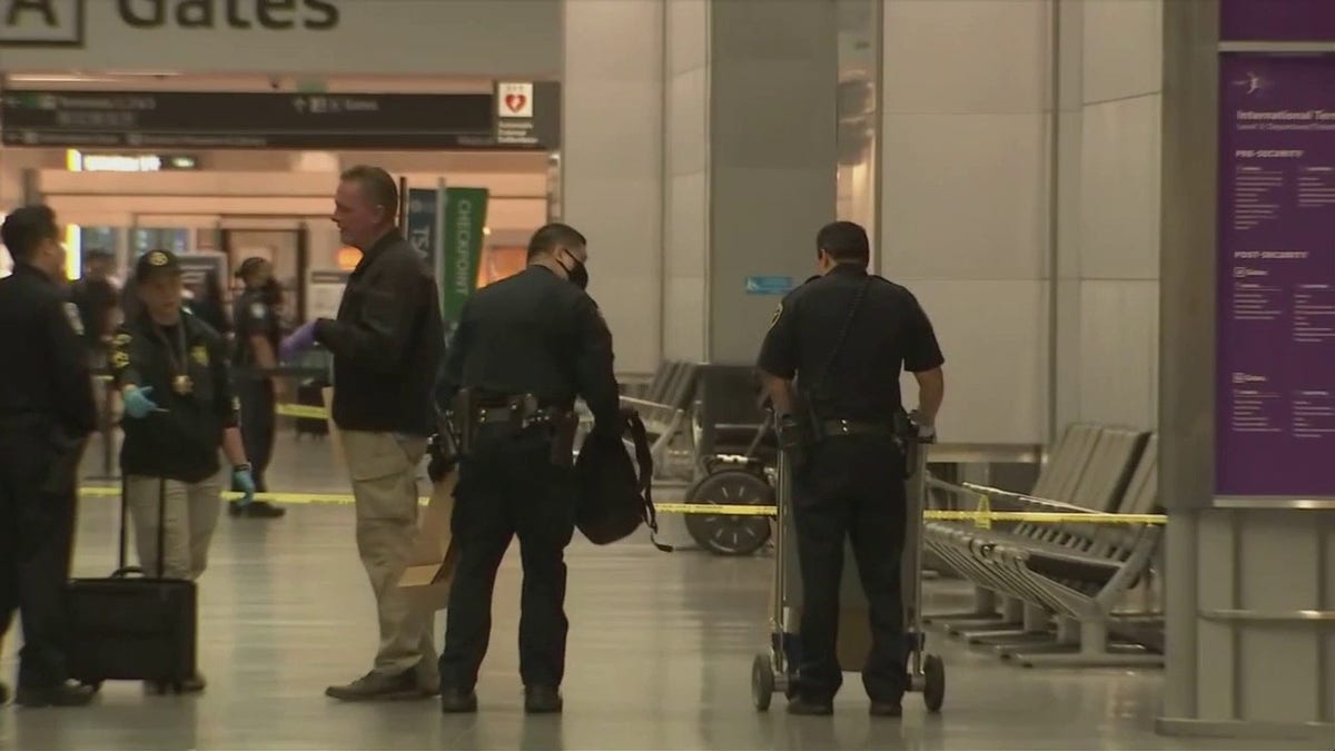 Police respond at San Francisco International Airport after a suspect was arrested in an attack that injured three.