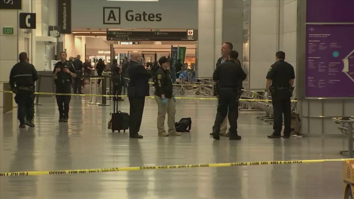 Police respond at San Francisco International Airport after a suspect was arrested in an attack that injured three.