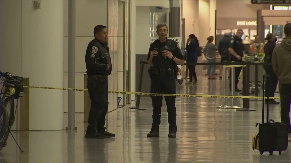 Police respond at San Francisco International Airport after a suspect was arrested in an attack that injured three.