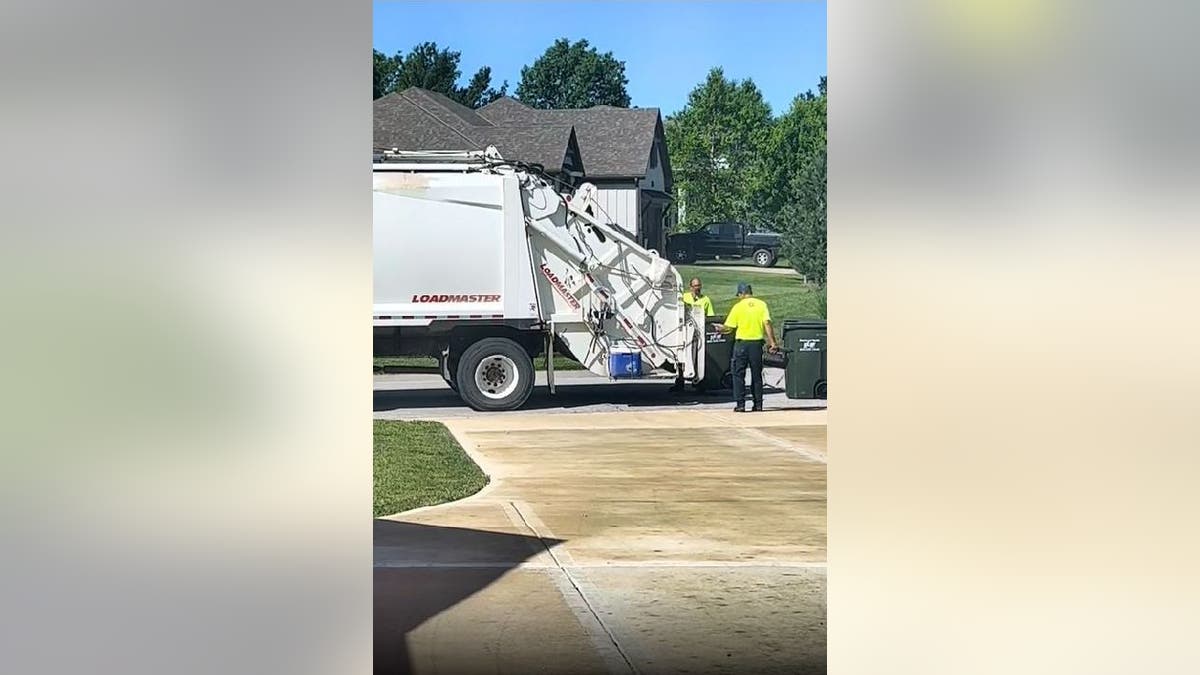 Two sanitation workers find cooler filled with snacks and drinks
