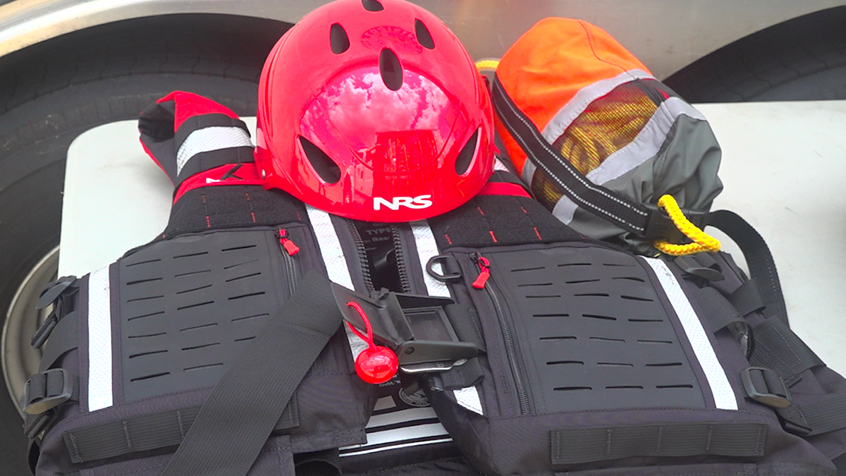 Hurricane rescue gear including swift-water vests and helmet