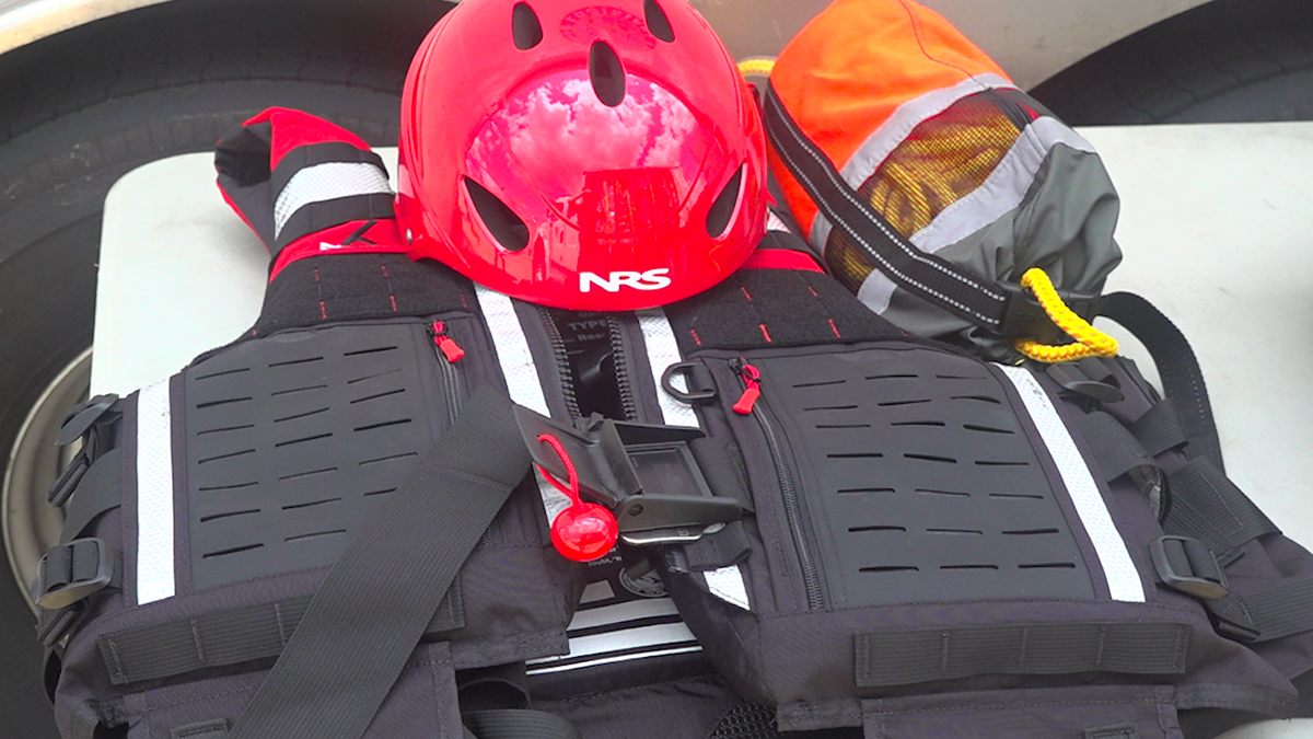 Hurricane rescue gear including swift-water vests and helmet