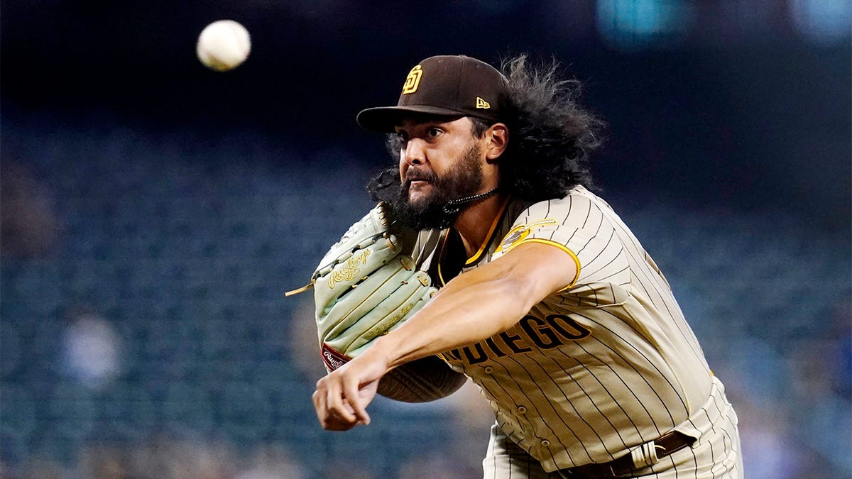 Sean Manaea throws a pitch