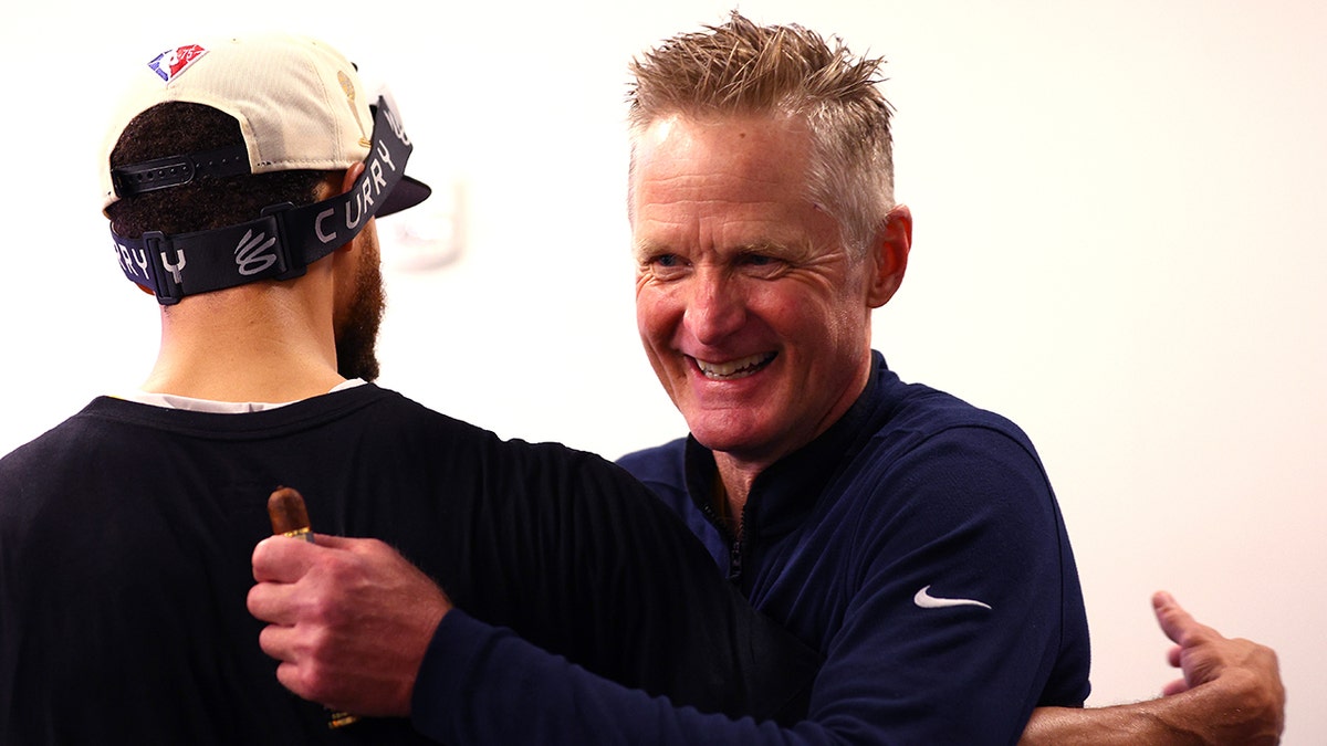 Steve Kerr and Steph Curry celebrate