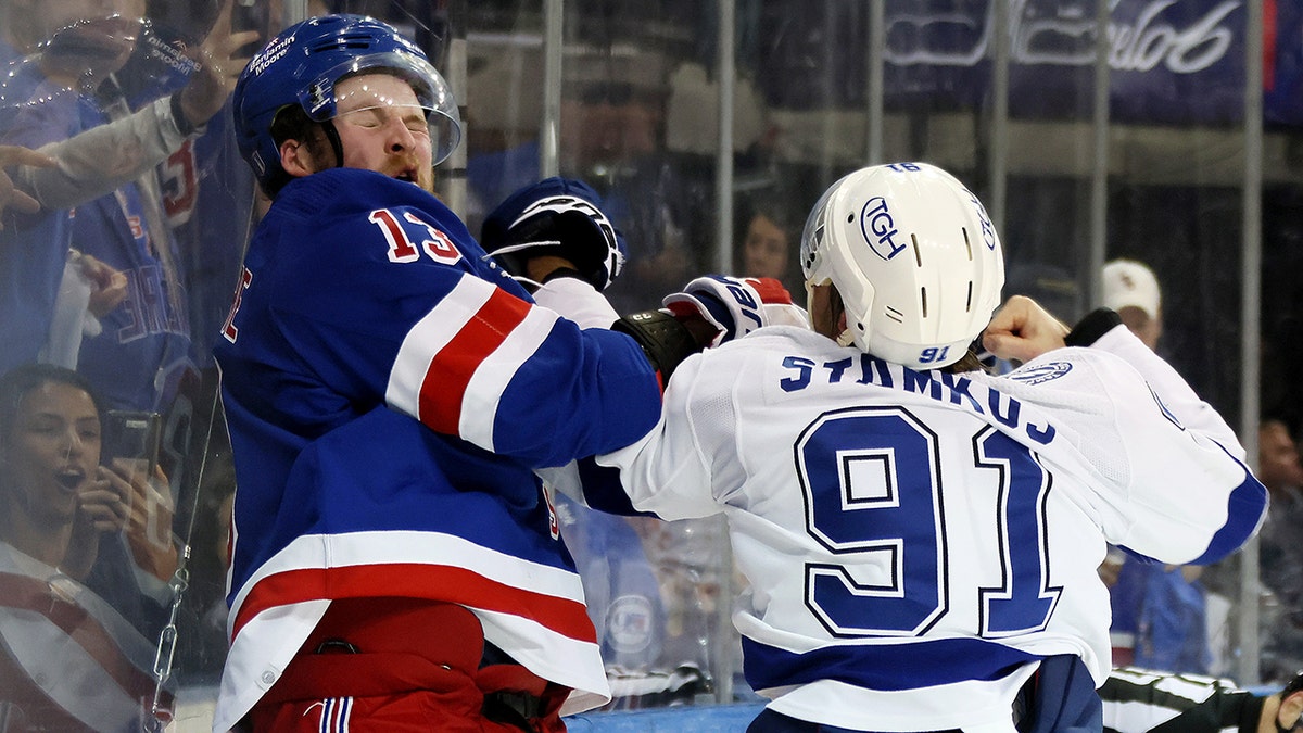 Steven Stamkos #91 of the Tampa Bay Lightning fights with Alexis Lafrenière #13 of the New York Rangers at the end of the third period in Game Five of the Eastern Conference Final of the 2022 Stanley Cup Playoffs at Madison Square Garden on June 9, 2022 in New York City.