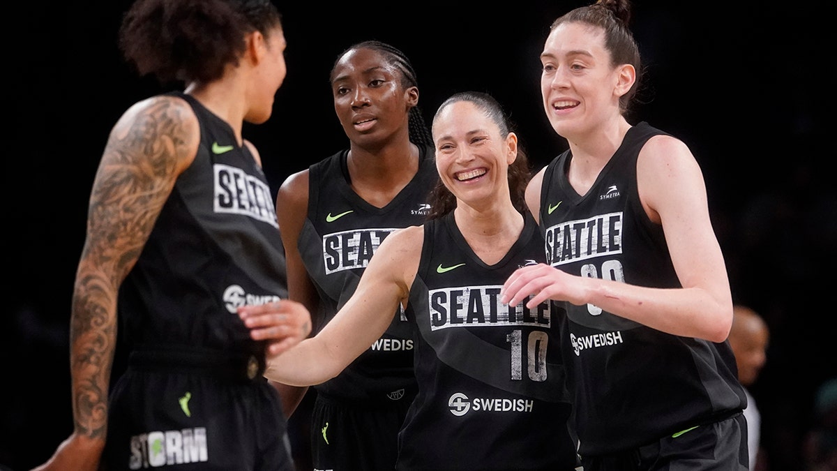 Sue Bird celebrates with teammates