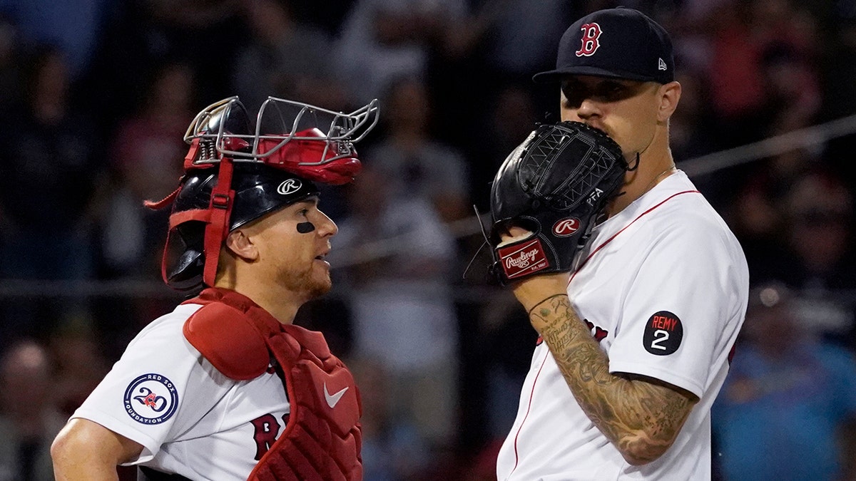 Tanner Houck confers with Christian Vazquez