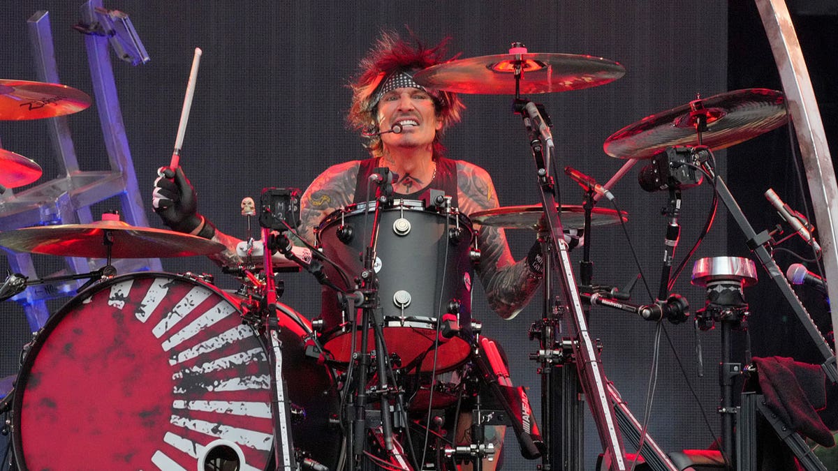 Tommy Lee plays the drums