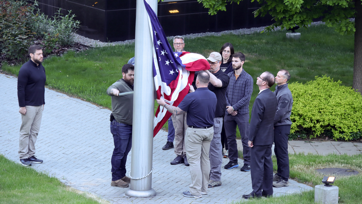 American flag is seen being raised at U.S. Embassy in Kyiv, Ukraine