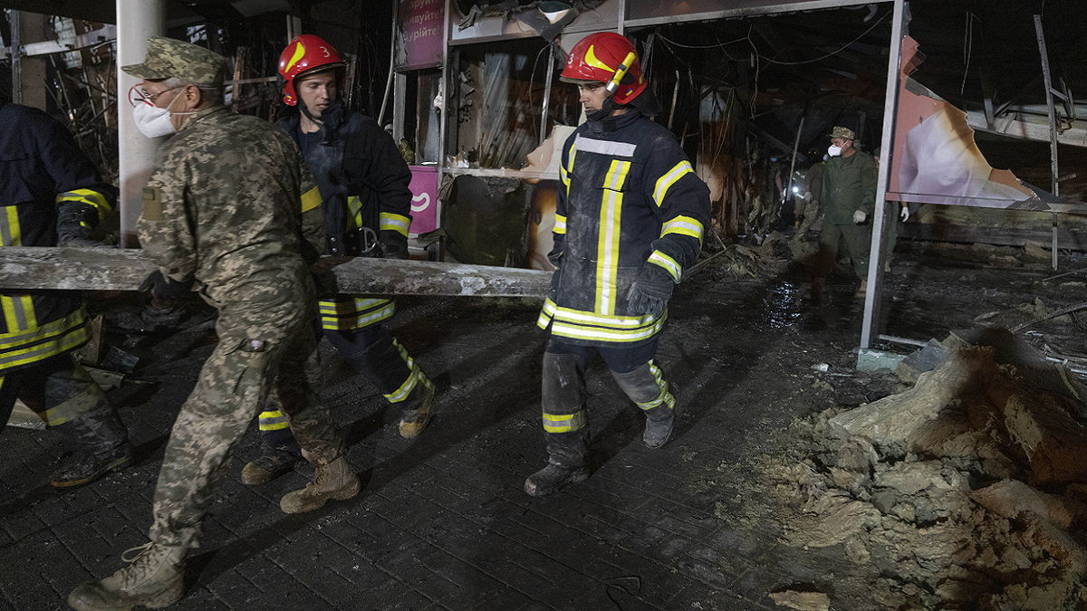 Firefighters assist at Ukraine Kremenchuk mall disaster