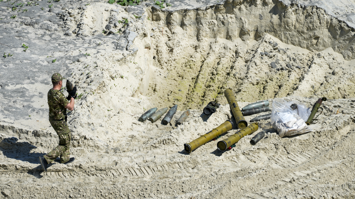 Ukrainian servicemen prepare unexploded Russian ammunition for destruction in the outskirts of Kyiv, Ukraine, on Wednesday, June 1.