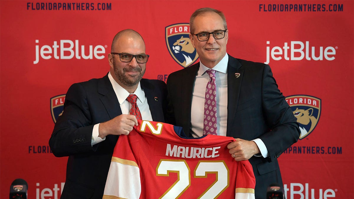 Bill Zito and Paul Maurice holding up jersey