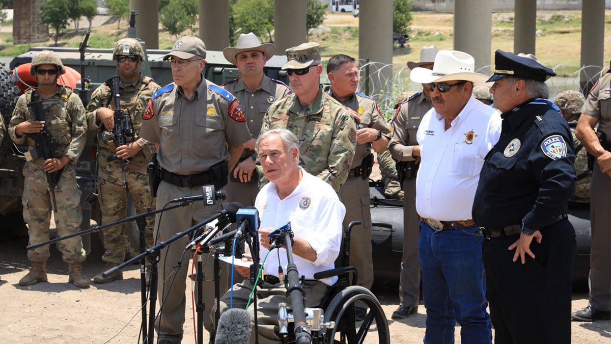 Greg Abbott at border after migrant deaths