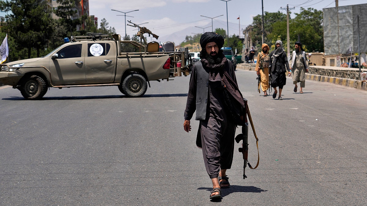 Taliban fighters at explosion site