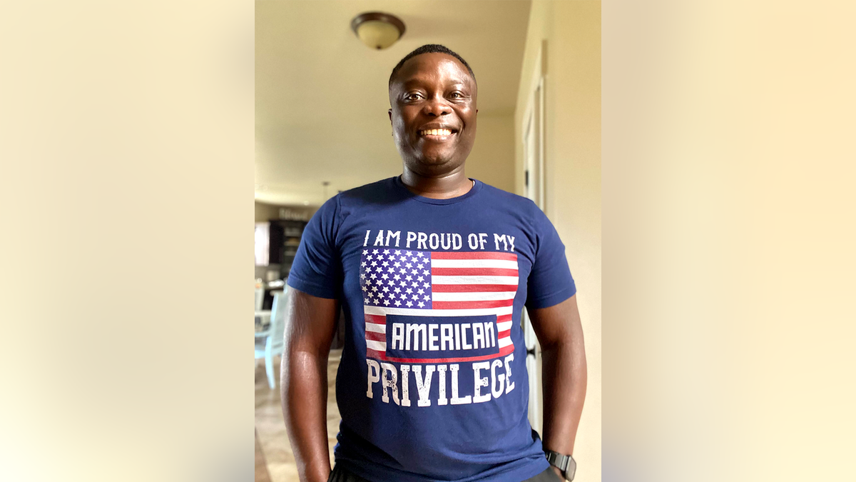 Ghanaian immigrant wearing patriotic T-shirt 