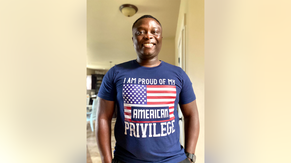Ghanaian immigrant wearing patriotic T-shirt