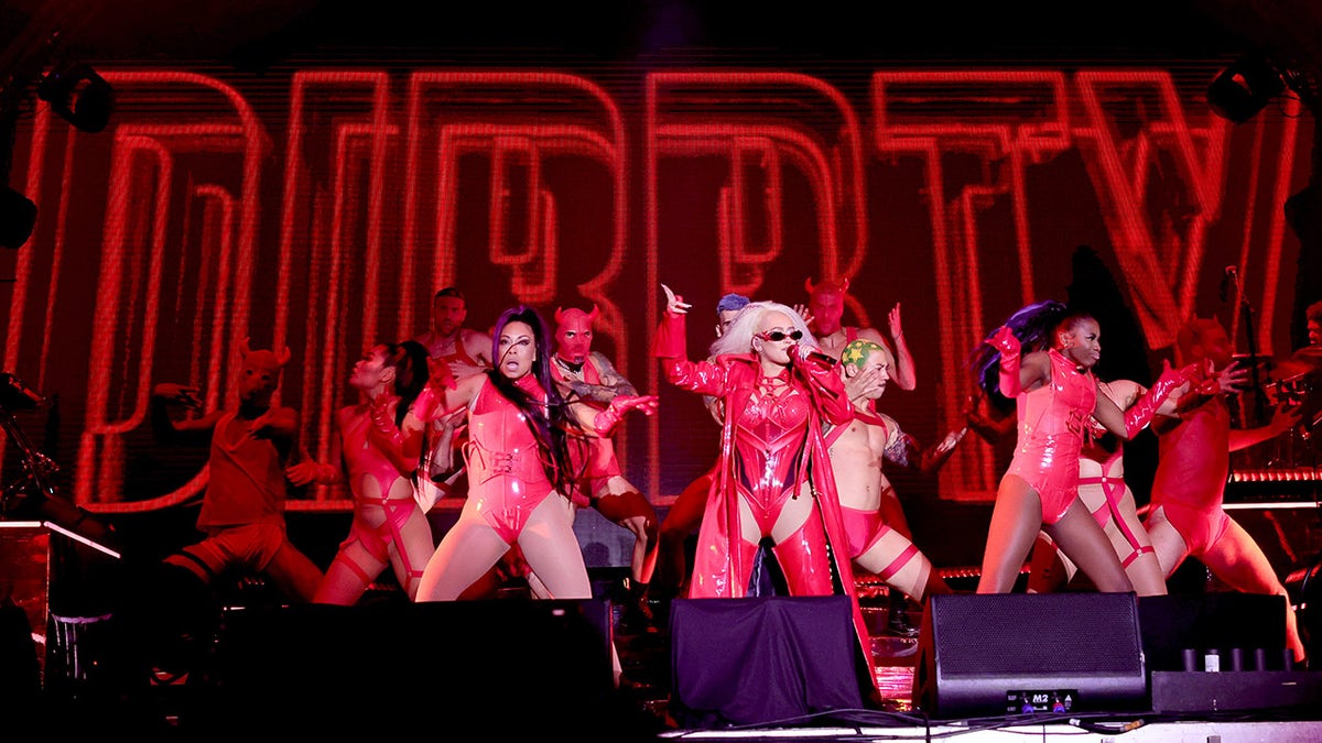 Christina Aguilera wears a red leather bodysuit for 'Dirrty’ performance at LA Pride fest.