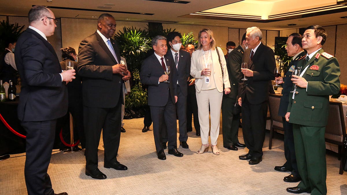 U.S. Secretary of Defense Lloyd Austin, second fro left, and other defense ministers gather during the 19th International Institute for Strategic Studies (IISS) Shangri-la Dialogue, Asia's premier defense forum, in Singapore, Saturday, June 11, 2022. 