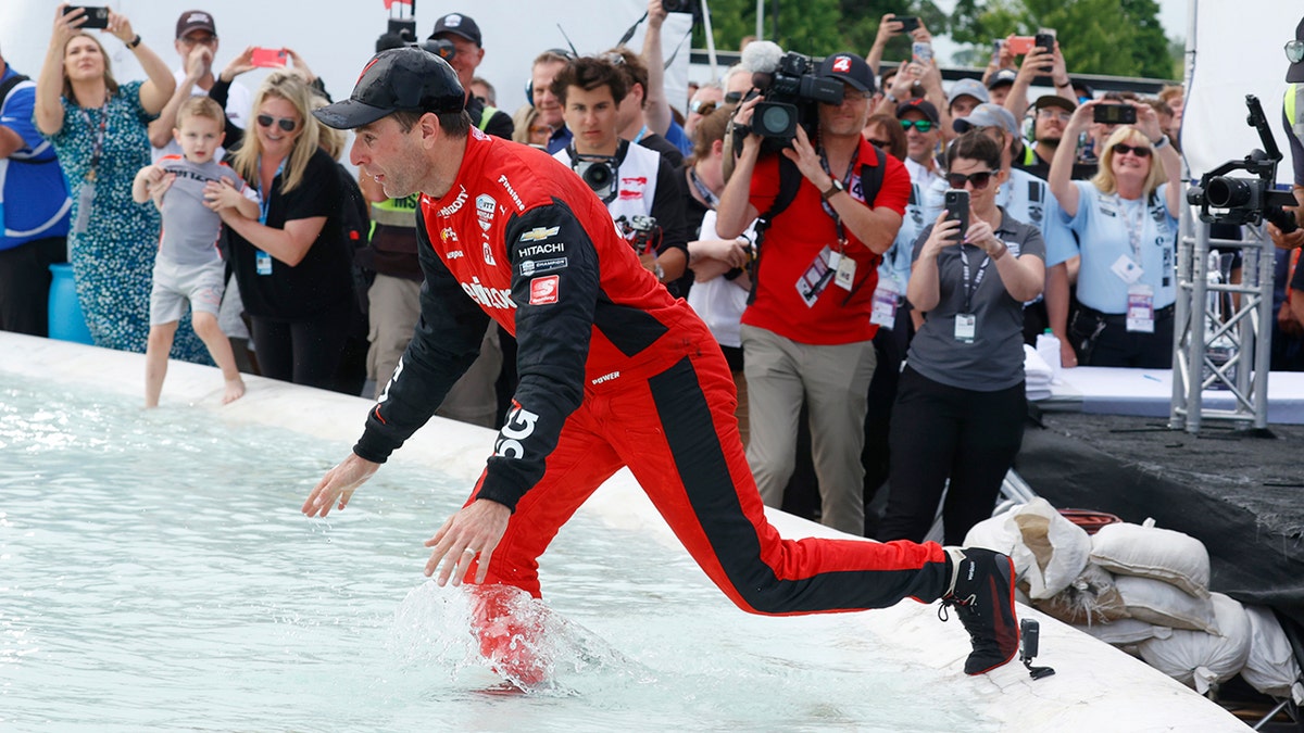 Will Power jumping in fountain