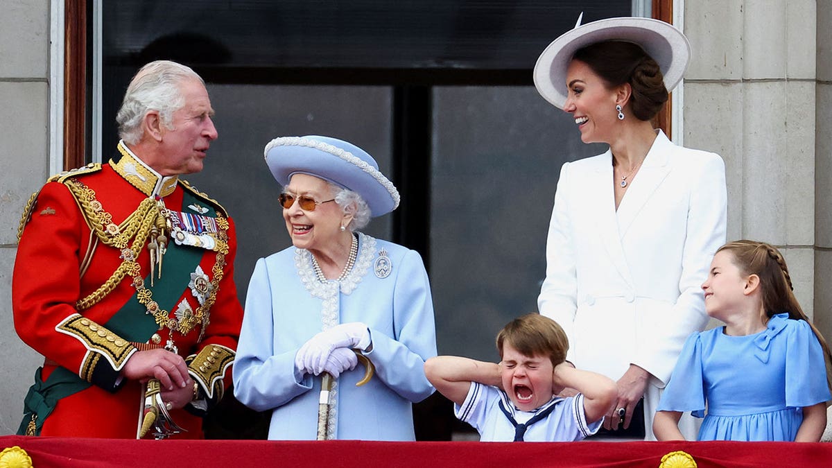 Queen Elizabeth, Charles, and Kate on balcony