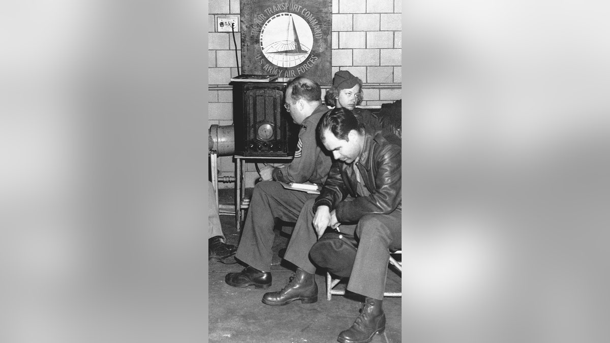 Military staff listening to Roosevelt pray