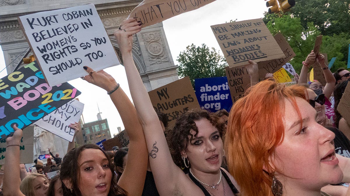 NYC protestors with signs