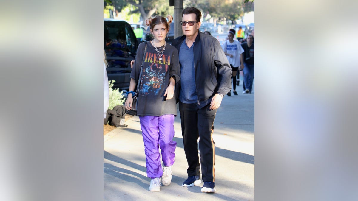 Charlie and Sami Sheen walking together