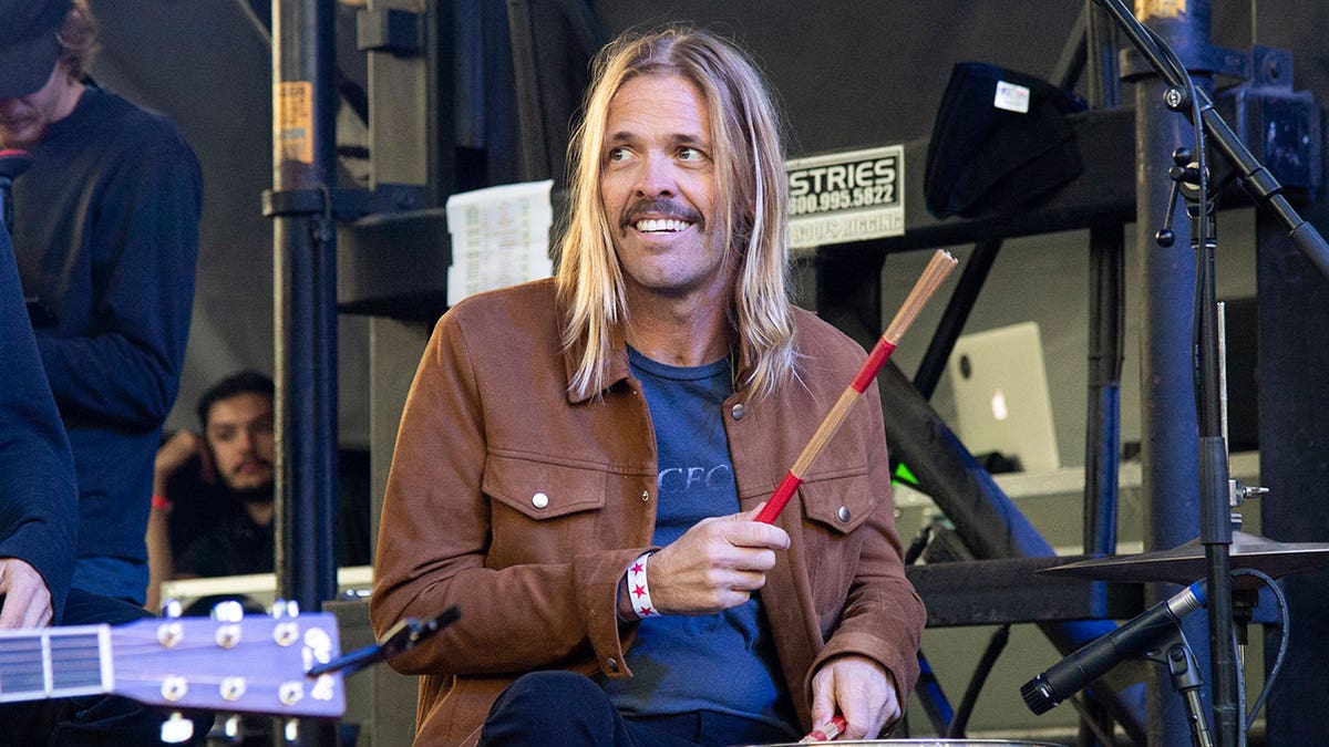 Taylor Hawkins plays the drums