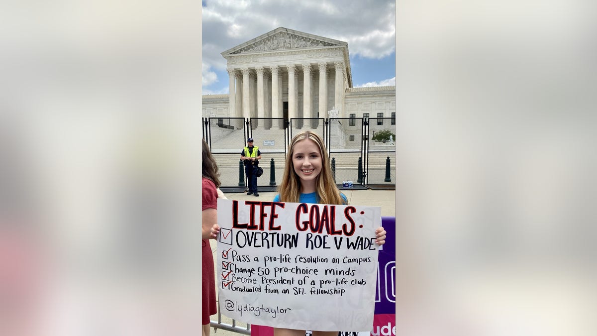 Girl holds a pro-life sign