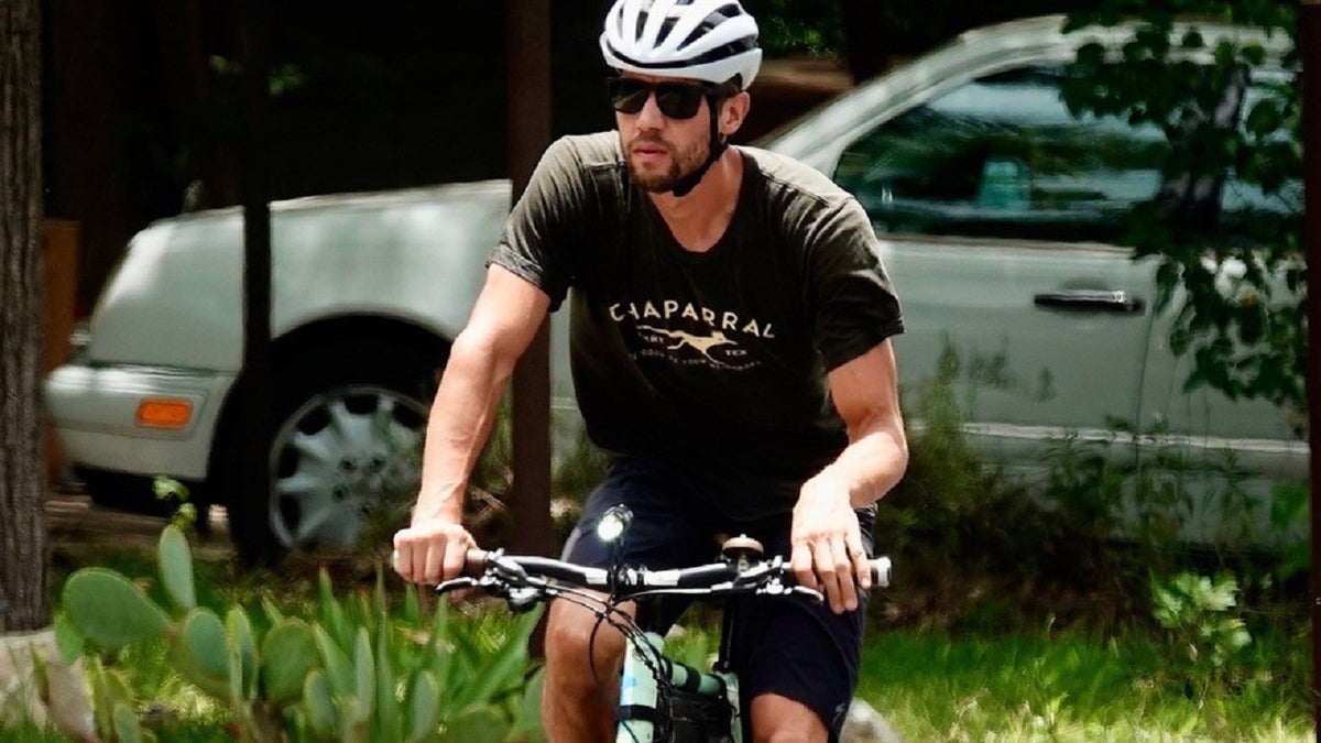 Colin Strickland riding a bike wearing a helmet