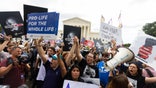 SuprCrowds outside the court reacting to the Dobbs ruling.eme Court abortion protesters are seen after Roe v. Wade was overturned
