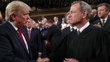 Chief Justice John Roberts with former President Donald Trump