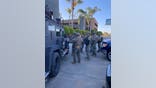 A gunman surrendered to Los Angeles police after taking hostages.