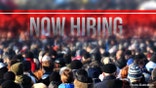 a photo of a now hiring sign