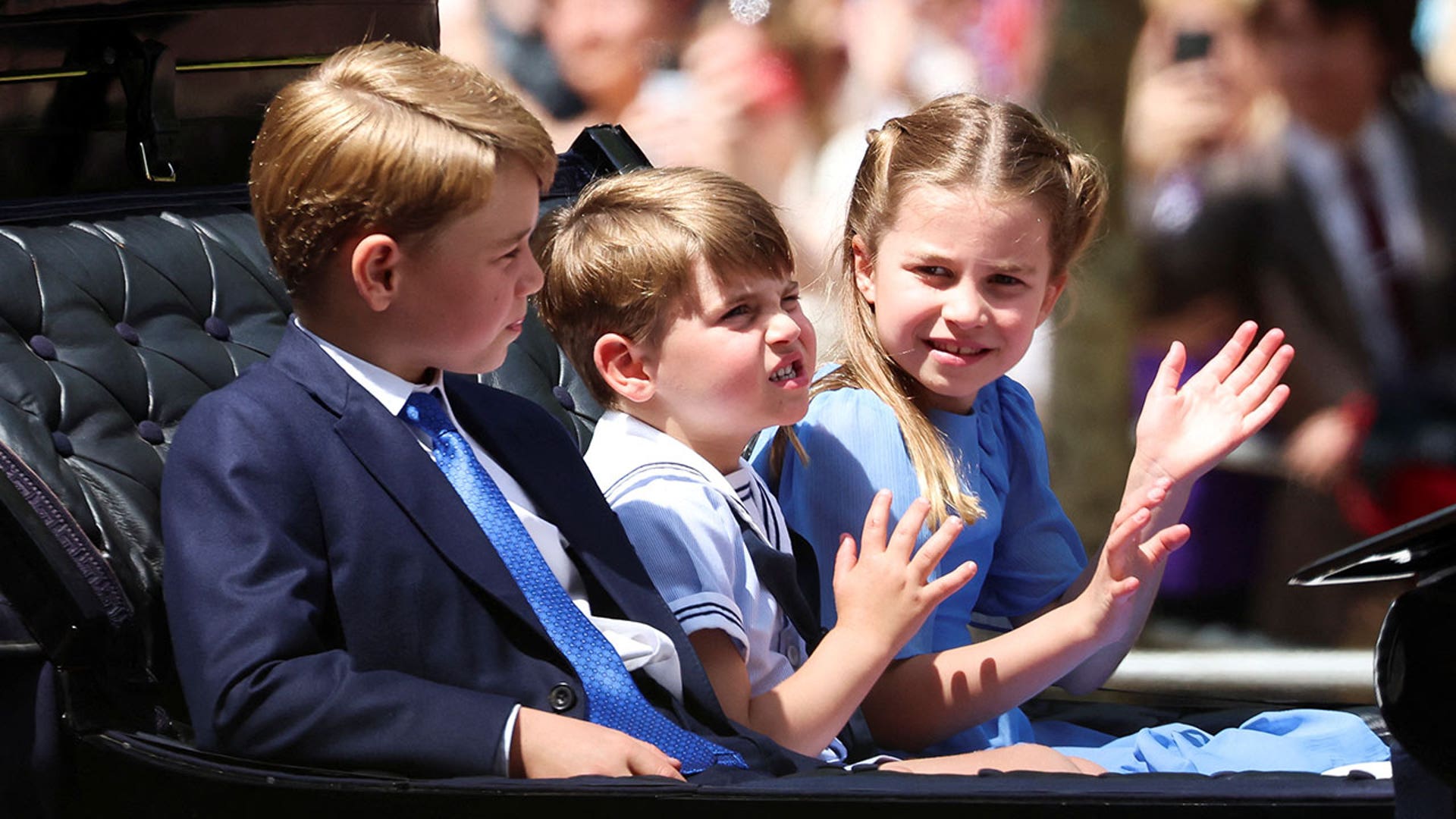 Cambridge children wave during parade