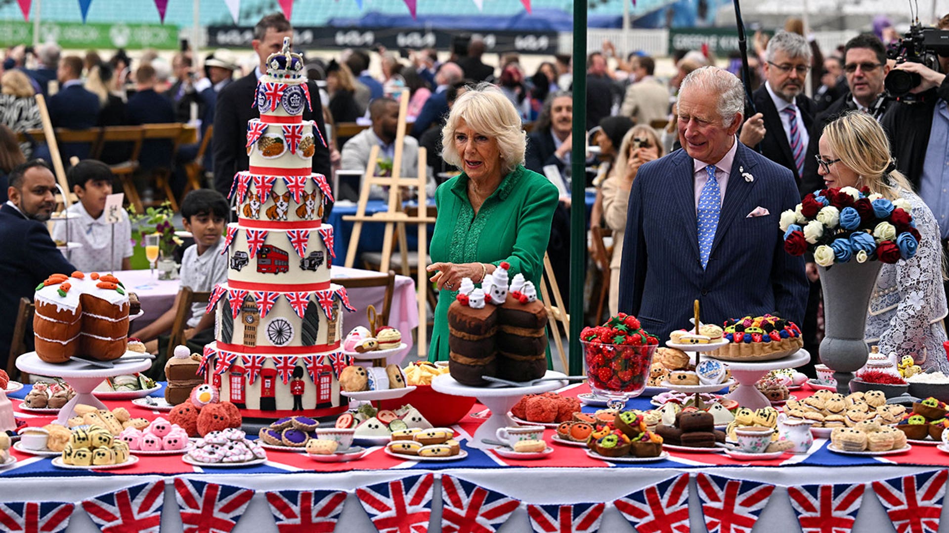 Charles and Camilla look at decorations at the Oval cricket grounds