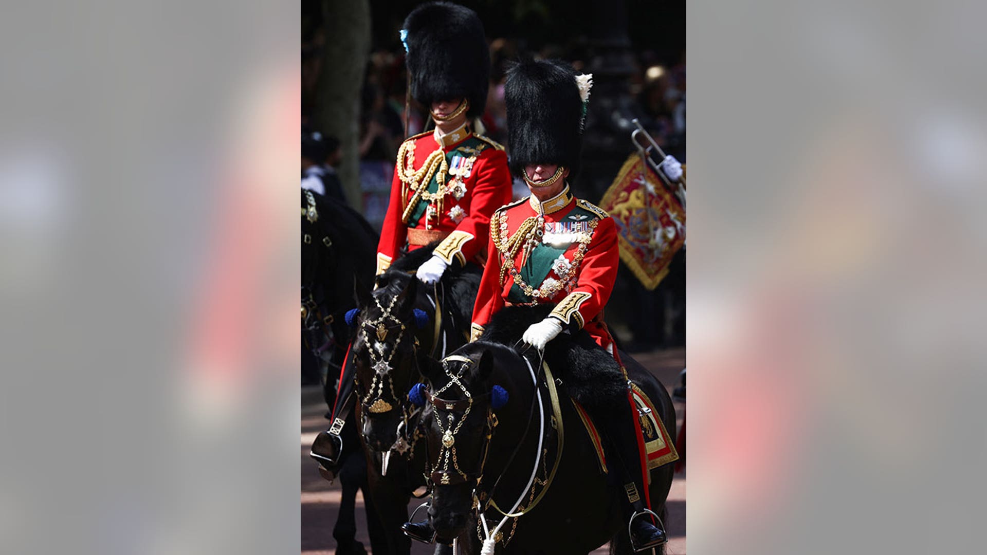 Charles and William ride horseback during Trooping